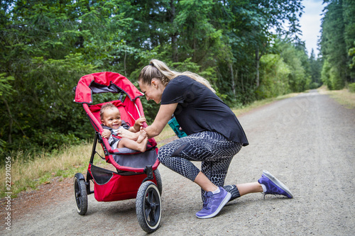 Fotografie, Obraz Woman and her little boy taking a break from working out