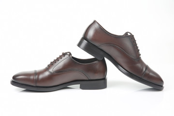 Classic men's brown Oxford shoes on white background. Leather shoes