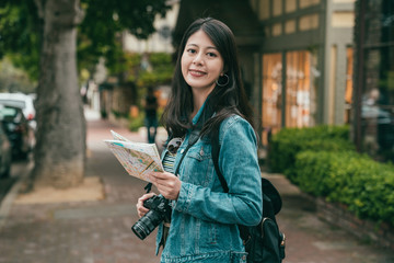 woman smiling joyfully to camera and sighseeing