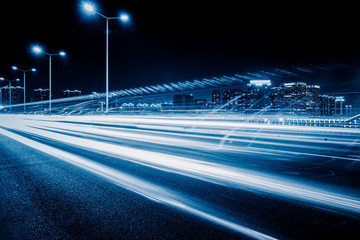 Vehicle light trails in city at night.