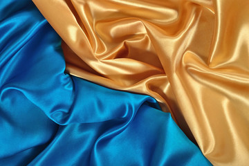 Natural golden and blue satin fabric texture