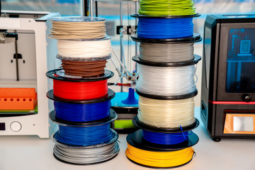 Sticker - ABS and PLA filament next to 3D Printer. Plastic   coils