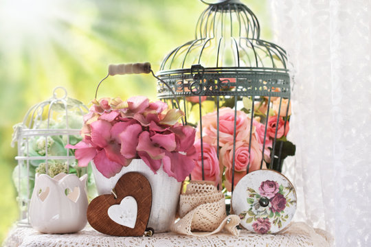 vintage style decoration with flowers and bird cages