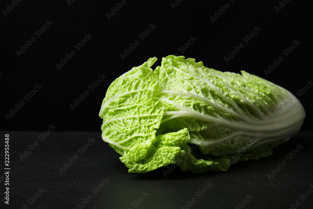 Fresh ripe cabbage on dark background