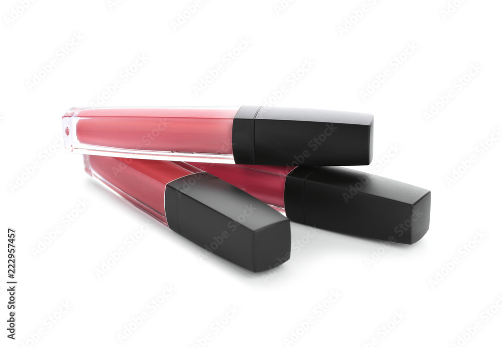 Liquid pink lipsticks on white background