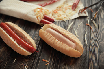 preparation of hot dogs with sausage.photo on a wooden backgroun