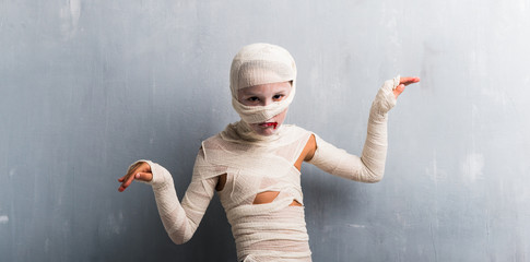 Wall Mural - Boy in mummy costume for halloween holidays