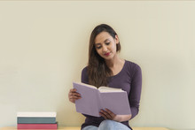 Young Woman Reading Book