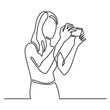 continuous line drawing of woman making photos with smartphone camera