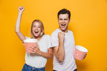 Sticker - Cheerful young couple standing isolated over