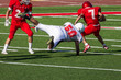 Football player diving for a tackle 