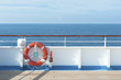 Ship deck, buoy and blue ocean. Travel background