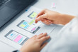 © Syda Productions - app design, technology and business concept - web designer working on user interface and creating wireframe layout at office