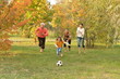 © aletia2011 - Big happy family playing football in autumn park