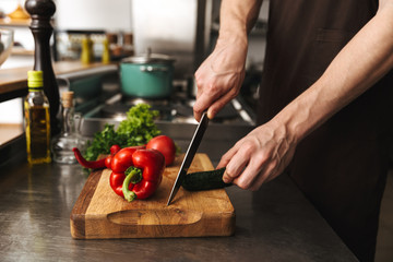 Close up of a man hands chopping vegetables