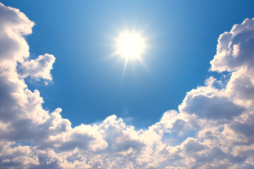 Wall Mural - blue sky with clouds and sun reflection.the sun shines bright in the daytime in summer
