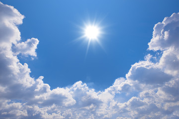 Wall Mural - blue sky with clouds and sun reflection.the sun shines bright in the daytime in summer