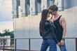 © LIGHTFIELD STUDIOS - multicultural sexy couple flirting and going to kiss on urban roof