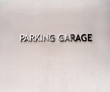 © Fitz - Parking Garage Sign on a Textured Concrete Wall