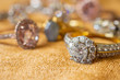 © Kwangmoozaa - Jewelry diamond rings on golden fabric background close up