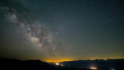 Wall Mural - the stars and milky way move across the night sky.