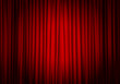 Closed red curtain background and spotlight. Theatrical drapes.