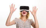 Fototapeta Do pokoju - Smiling woman in virtual reality glasses. VR device. Woman with VR headset. Happy woman in virtual reality headset isolated on white background. Future. Future technology concept.