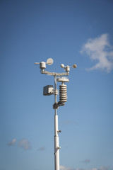 weather stations with blue skies and clouds