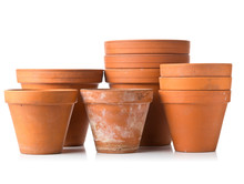 Group Of Empty, Stacked, Used Terracotta Planting Pots Over White