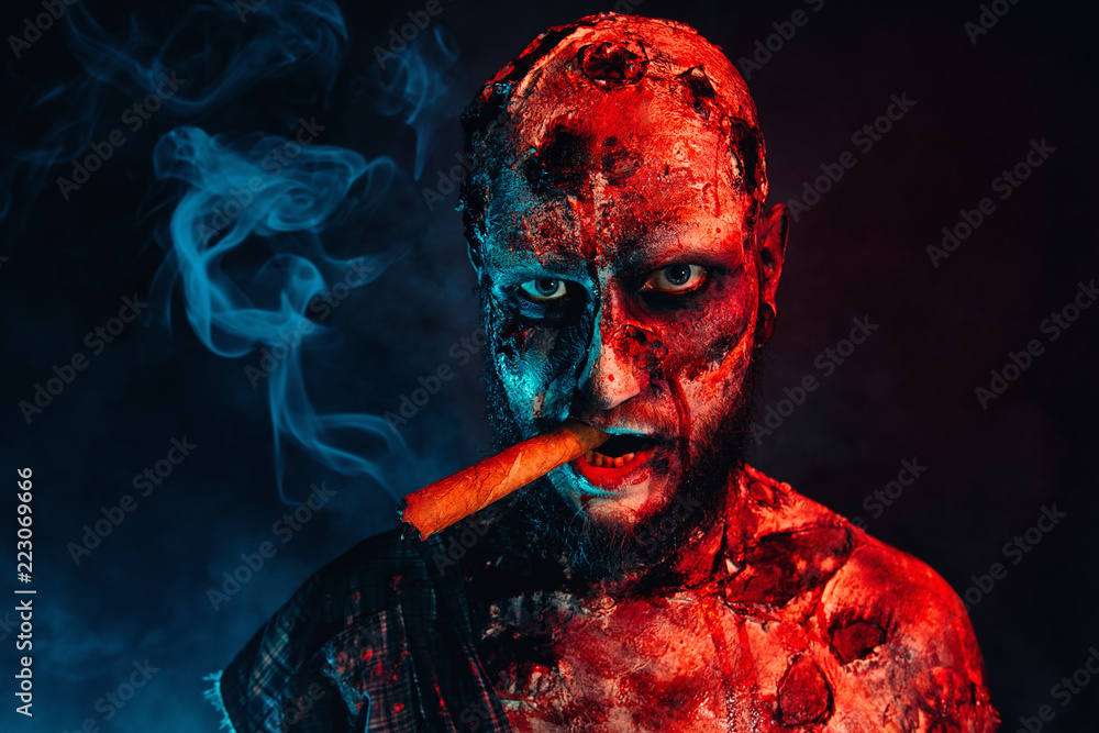 zombie cigarette zombie smoking a cigar Stock Photo