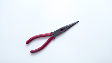 Wire cutter red on white background