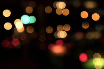 Wall Mural - Blurry background image of defocused colorful lights at night
