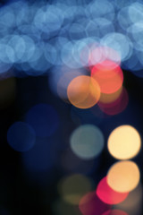Wall Mural - Blurry background image of defocused colorful lights at night