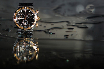 Luxury waterproof watches in water splashes