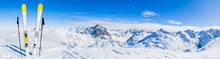 Ski In Winter Season, Mountains And Ski Touring Equipments On The Top In Sunny Day In France, Alps Above The Clouds.
