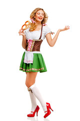 Wall Mural - Oktoberfest / Creative concept photo of Oktoberfest waitress wearing a traditional Bavarian costume with pretzels isolated on white background.