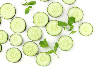 Wall Mural - Sliced cucumber and mint background with copyspace