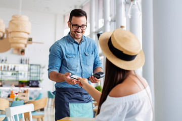 Customer paying his bills using credit card