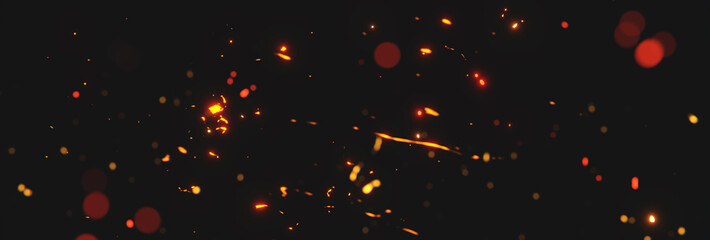 blurred sparks from fire in front of black backgound