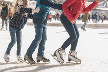 Happy Family Have Outdoor Activity, Christmas, Outdoor Ice Skating Rink