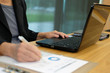 © 88studio - woman using computer. businesswoman working with financial chart diagram