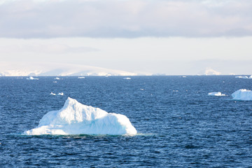 ice in the Antarctica with iceberg in the ocean