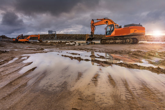 Works in the construction of a road extracting stone in a hard day of winter work