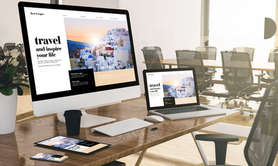 Wall Mural - computer, laptop, tablet, and phone with responsive travel blog website  at office mockup