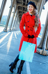 Wall Mural - tourist woman with shopping bag in Paris looking into distance