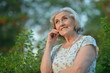 © aletia2011 - beautifil elderly woman posing in autumn park