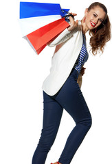 Wall Mural - happy fashion-monger with shopping bags on white background