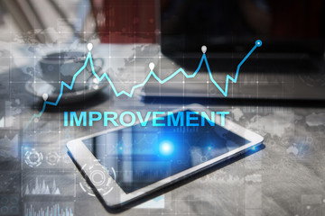 Improvement graph on virtual screen. Business and technology concept.