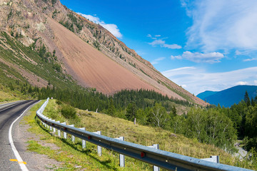 Fragment of the road that extends beyond the great mountain, Republic of Altai, Russia