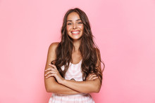 Image Of European Lovely Woman 20s With Long Hair Wearing Dress Smiling At You With Arms Crossed, Isolated Over Pink Background